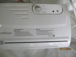 lot 23 image: FoodSaver vacuum sealing system wit...