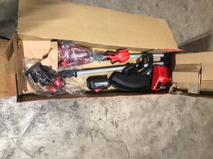 lot 45 image: Milwaukee M18 18V Lithium-Ion Brushless Cordless String Trimmer Kit with  Battery and Charger   Customer Returns See Pictures