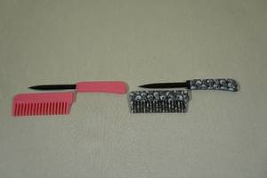 lot 36 image: 2 Hair Comb Knives