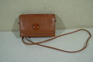 lot 207 image: Dooney and Bourke All Weather Leather Crossbody Purse
