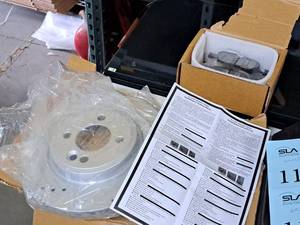 lot 1182 image: Lot of (One Pair) Cross-DrilledSlotted Performance Rotors and Pads (New)