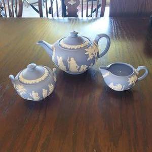 lot 50 image: Vintage Wedgewood Blue Jasperware - Tea Pot, Sugar Dish and Creamer