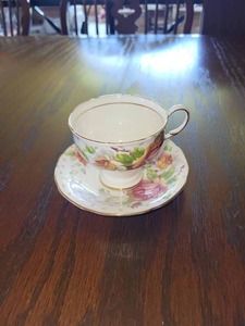 lot 68 image: Vintage Paragon Golden Emblem Fine Bone In China Tea Cup and Saucer