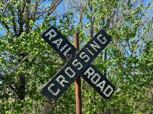 lot 5 image: Vintage Rail Road Crossing Sign with Glass Marbles