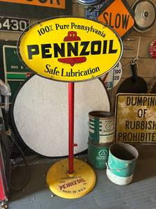 lot 11 image: Oval Pennzoil Porcelain Sign on Original Cast Iron Base