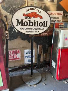 lot 13 image: Gargoyle Mobiloil Porcelain Sign on Original Cast Iron Base
