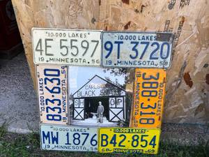 lot 73 image: Vintage MN License Plates Framed Around Black Smith Shop Photo
