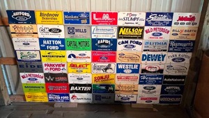 lot 87 image: Board Full of Advertising License Plates