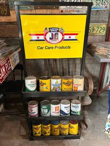 lot 177 image: Justice Bros Can Rack Full of Oil Cans