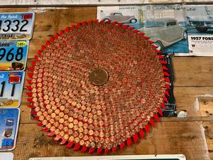 lot 207 image: Large Saw Blade Covered in US Pennies