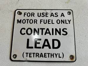 lot 370 image: Porcelain Contains Lead Pump Sign