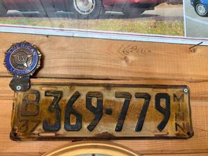 lot 311 image: 1937 MN License Plate with American Legion Plate Topper