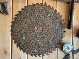 lot 318 image: Large Saw Blade Covered with Wheat Back Pennies