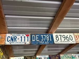 lot 490 image: Rafter of Assorted States Vintage License Plates