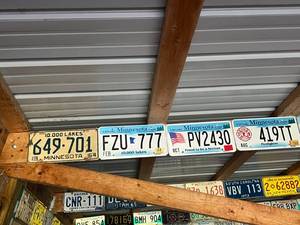 lot 491 image: Row of Assorted Vintage License Plates