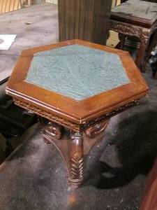lot 29 image: Wood and stone end table. Ornately ...