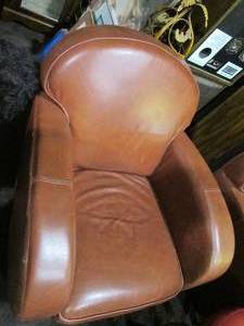 lot 31 image: Rust colored leather chair, does no...