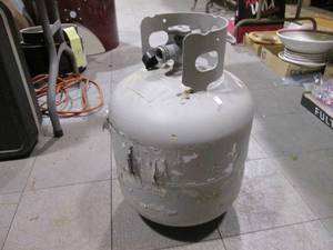 lot 148 image: 20lb propane cylinder with some fue...