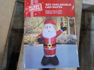 lot 21 image: Merry Moment 4 ft Inflatable LED Sa...