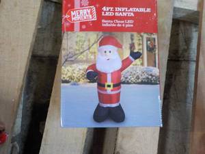 lot 22 image: Merry Moment 4 ft Inflatable LED Sa...