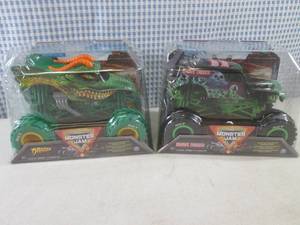 lot 255 image: (CSB) 2 Monster Jam Trucks Grave Di...