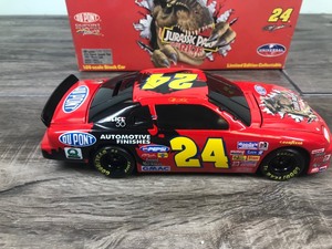 lot 343 image: 1997 Nascar Action Jeff Gordon Monte Carlo #24 DuPont  Jurassic Park 124 scale die cast coin bank