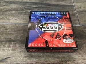 lot 347 image: 2000 Nascar Racing Champions Under the Lights Y2K Chevy Monte Carlo & 2K Ford Taurus 2 car set 164 scale die cast
