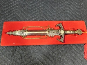 lot 5 image: Sword with metal case with skull on