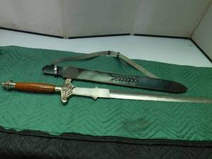 lot 29 image: woodmetal handle sword with leather sheath