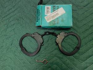 lot 28 image: stainless steel FURY handcuffs with key