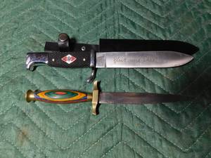 lot 83 image: Metal handle knife with metal sheath and brass and wood handle knife with leather sheath