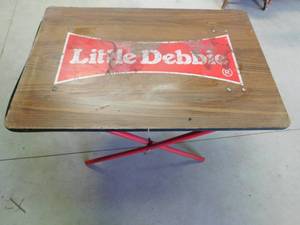 lot 121 image: Little Debbie display table with wood top