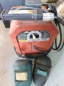 lot 162 image: Welder w 2 welding jelmets and rods