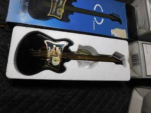 lot 173 image: new musical mini guitar  candle holders w candles