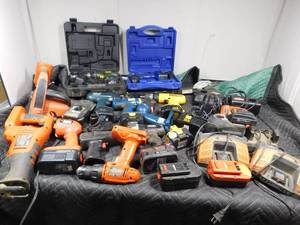 lot 442 image: batteries,chargers, and many power tools in metal case