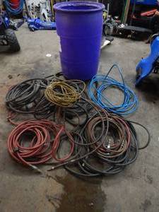 lot 26 image: Barrel Full Of Air Hose, Water Hose & High Pressure Hose