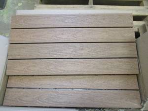 lot 715 image: NewTechWood UltraShield Naturale 2 ft. x 1 ft. Quick Deck Outdoor Composite Deck Tile in Peruvian Teak (20 sq. ft. Per Box) (OPEN BOX0