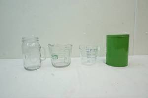 lot 394 image: Pyrex Measuring Cups and Tin
