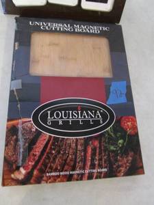 lot 92 image: Louisiana Grills Universal Magnetic Cutting Board.