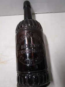 Red Star Stomach Bitters Bottle