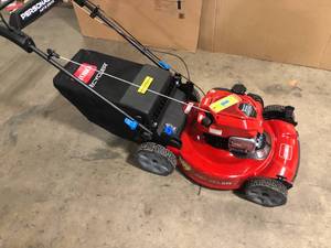 lot 28 image: Toro Recycler 22 in. Briggs And Stratton Personal Pace Rear Wheel Drive Walk Behind Gas Self Propelled Lawn Mower with Bagger  Customer Returns See Pictures