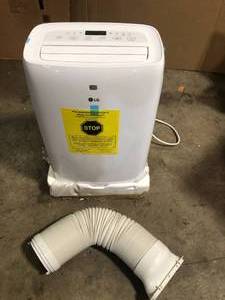 lot 31 image: LG 6,000 BTU (DOE) 115-Volt Portable Air Conditioner LP0621WSR Cools 250 Sq. Ft. with Dehumidifier Function and LCD Remote  Customer Returns See Pictures