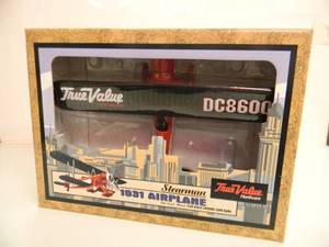 lot 13 image: ERTL COLLECTIBLES TRUE VALUE HARDWARE 1931 STEARMAN AIRPLANE DIE-CAST METAL BANK - IN BOX - GREAT PIECE - NICE - SEE PICTURES