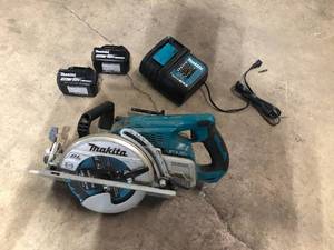 lot 18 image: Makita 18V X2 LXT 5.0Ah Lithium-Ion (36V) Brushless Cordless Rear Handle 7-14 in. Circular Saw Kit Customer Returns See Pictures
