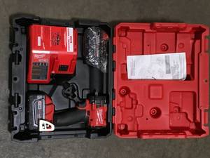 lot 39 image: Milwaukee M18 FUEL GEN-3 18V Lithium-Ion Brushless Cordless 38 in. Compact Impact Wrench with Friction Ring Kit  Customer Returns See Pictures