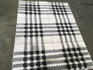 lot 49 image: Shag Black and White 5 ft. x 7 ft. Menswear Polypropylene Area Rug by Home Decorators Collection    Customer Returns See Pictures