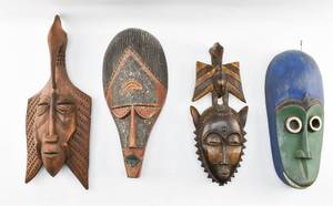 lot 63 image: 4 Oblong Carved Wood Masks