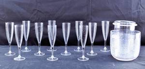 lot 266 image: 11 Plastic Champagne Flutes & Plastic Wine Chiller