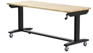 lot 28 image: Husky 62 in. W x 24 in. D Adjustable Height Solid Wood Top Workbench Table in Black see pictures