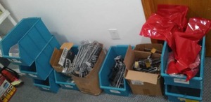 Plastic bins and pegboard hooks.
